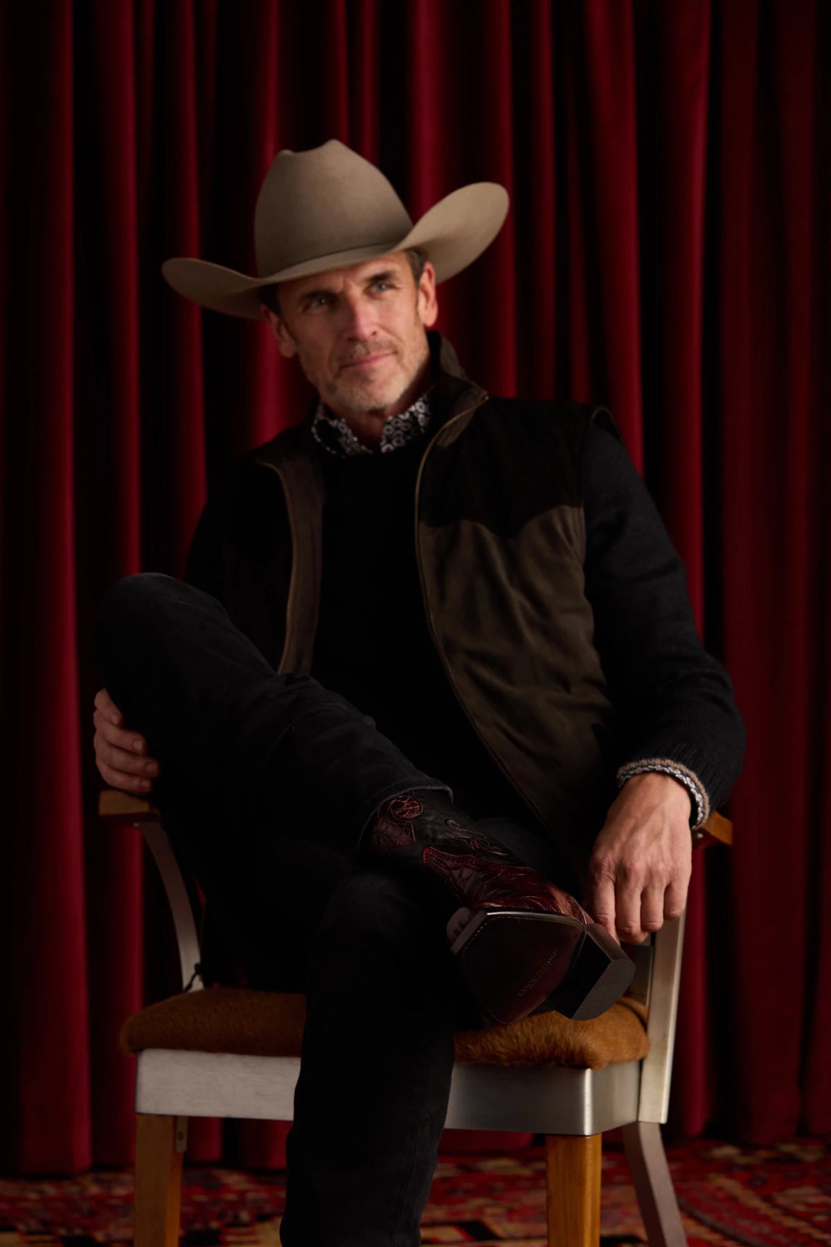 Mission Black Cherry — seated, boot crossed showing alligator vamp + inlay 12